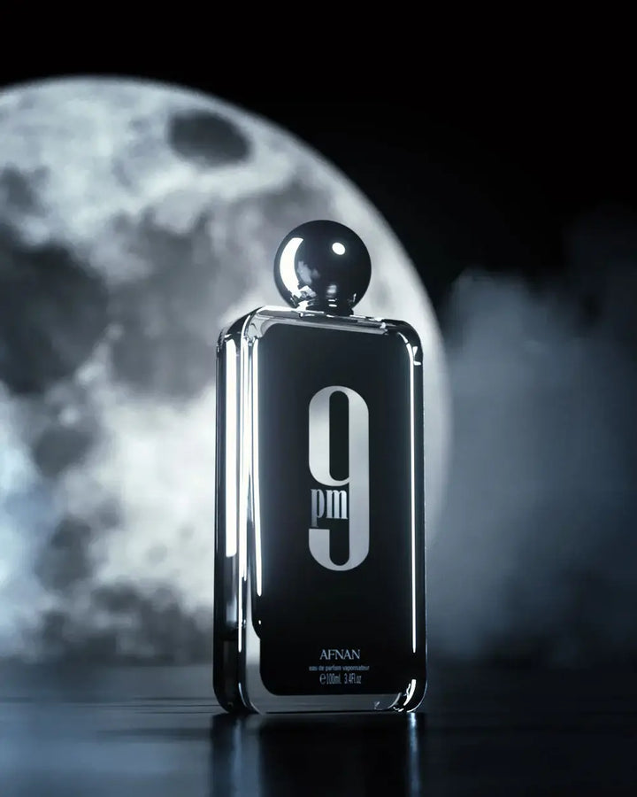 Image of 9 PM fragrance bottle against a dramatic moonlit background.