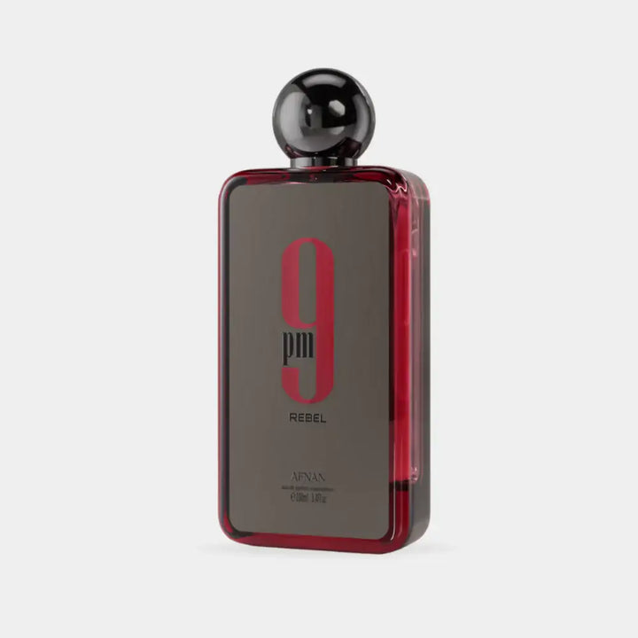 Elegant bottle of 9 PM Rebel perfume showcasing its captivating design and allure.